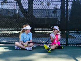 girls at a tennis court